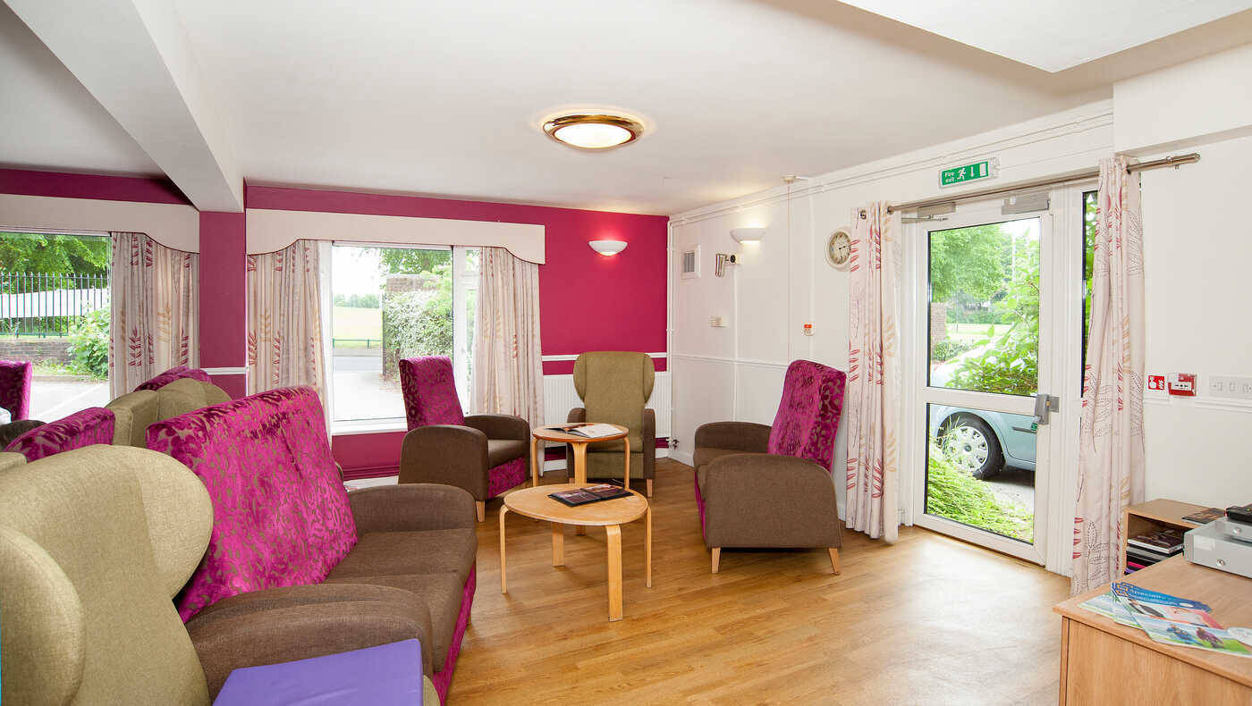 Bright common area with seating and outdoor view