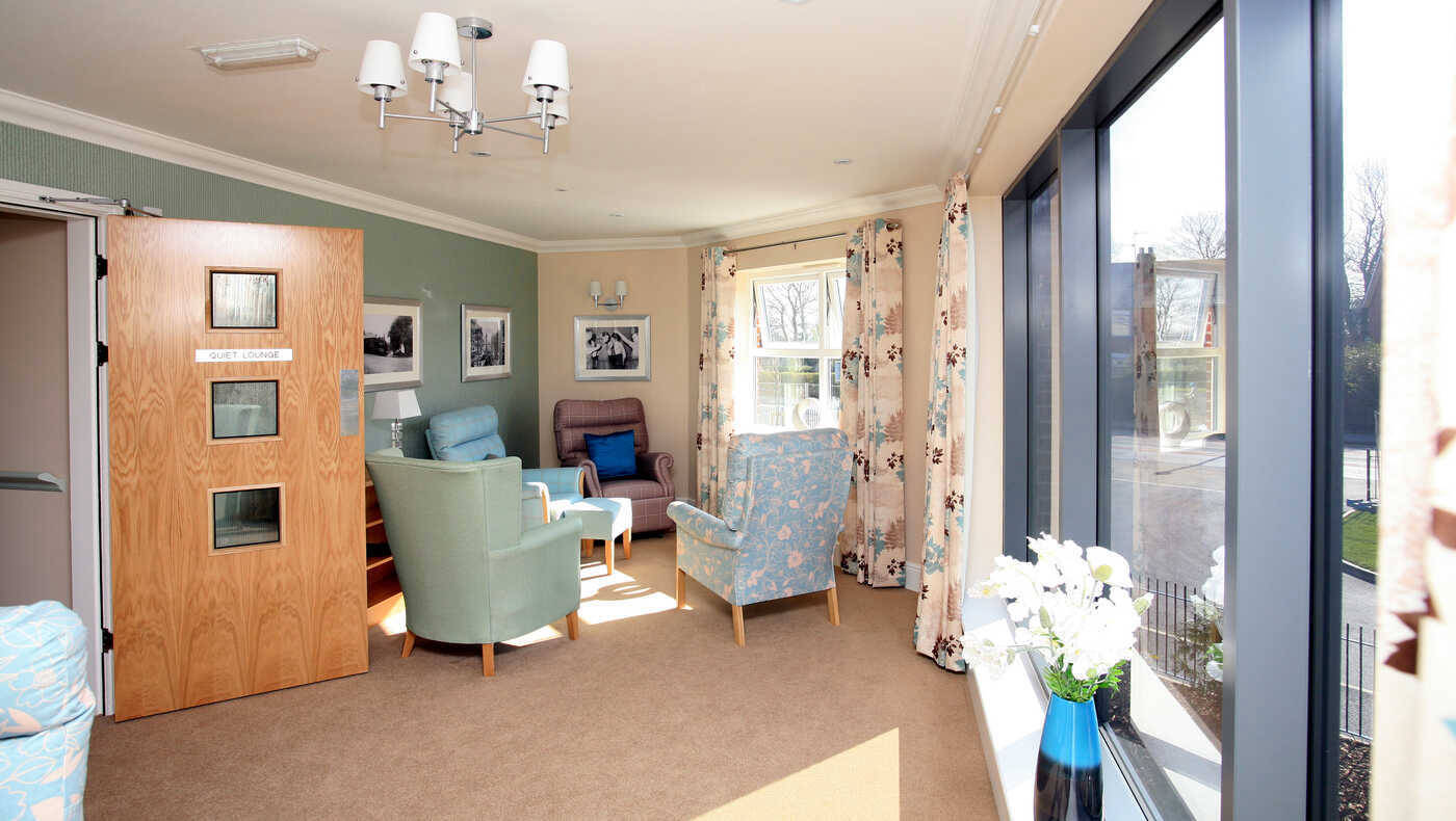 Brightly lit living room with comfortable seating