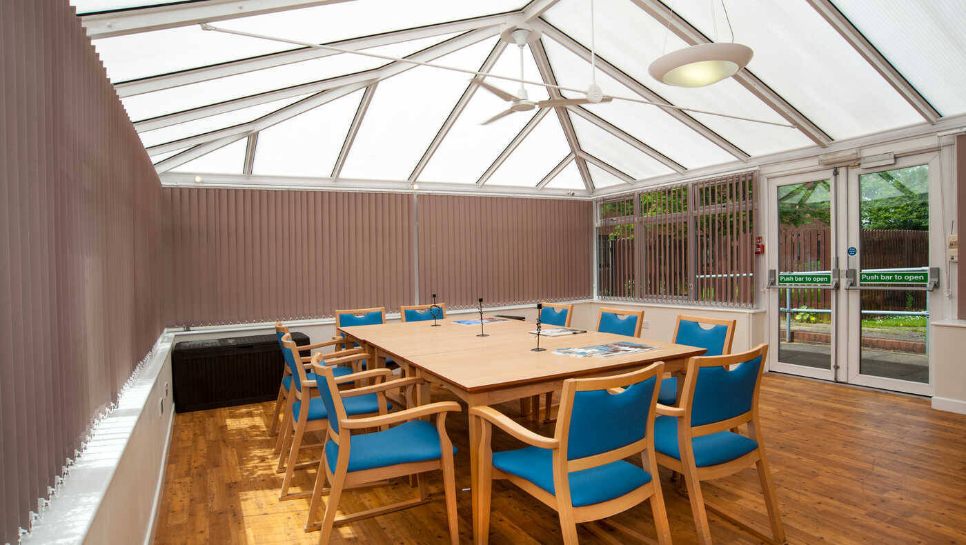 Interior common area with a large meeting table and chairs