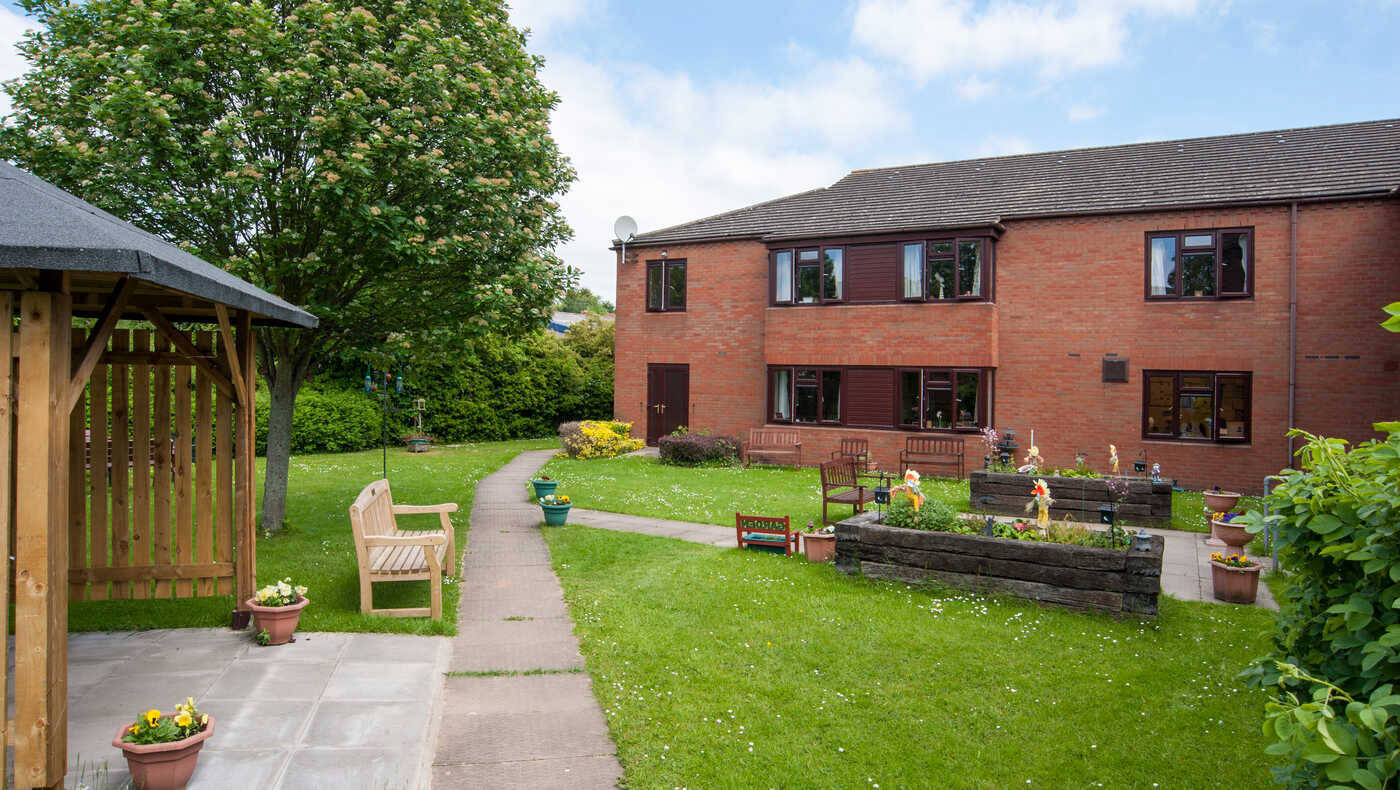 Outdoor space with garden and building in view