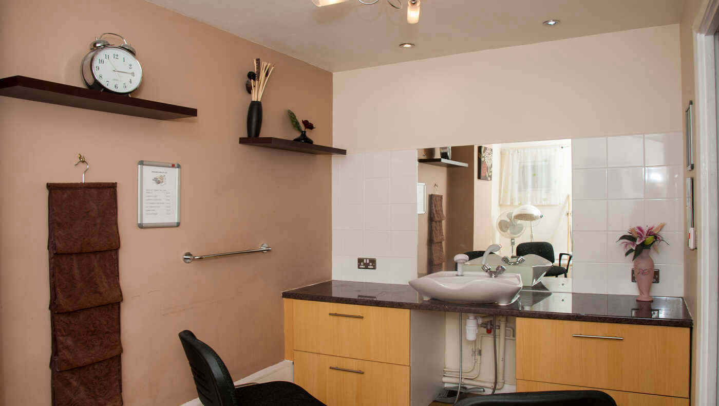 Interior space with a sink and mirror