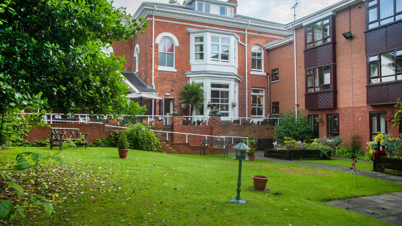 Exterior view of the facility's garden and building