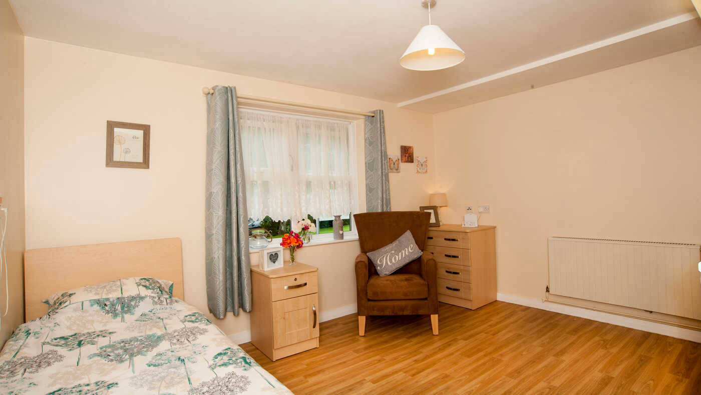 Cozy resident room with furniture and decor