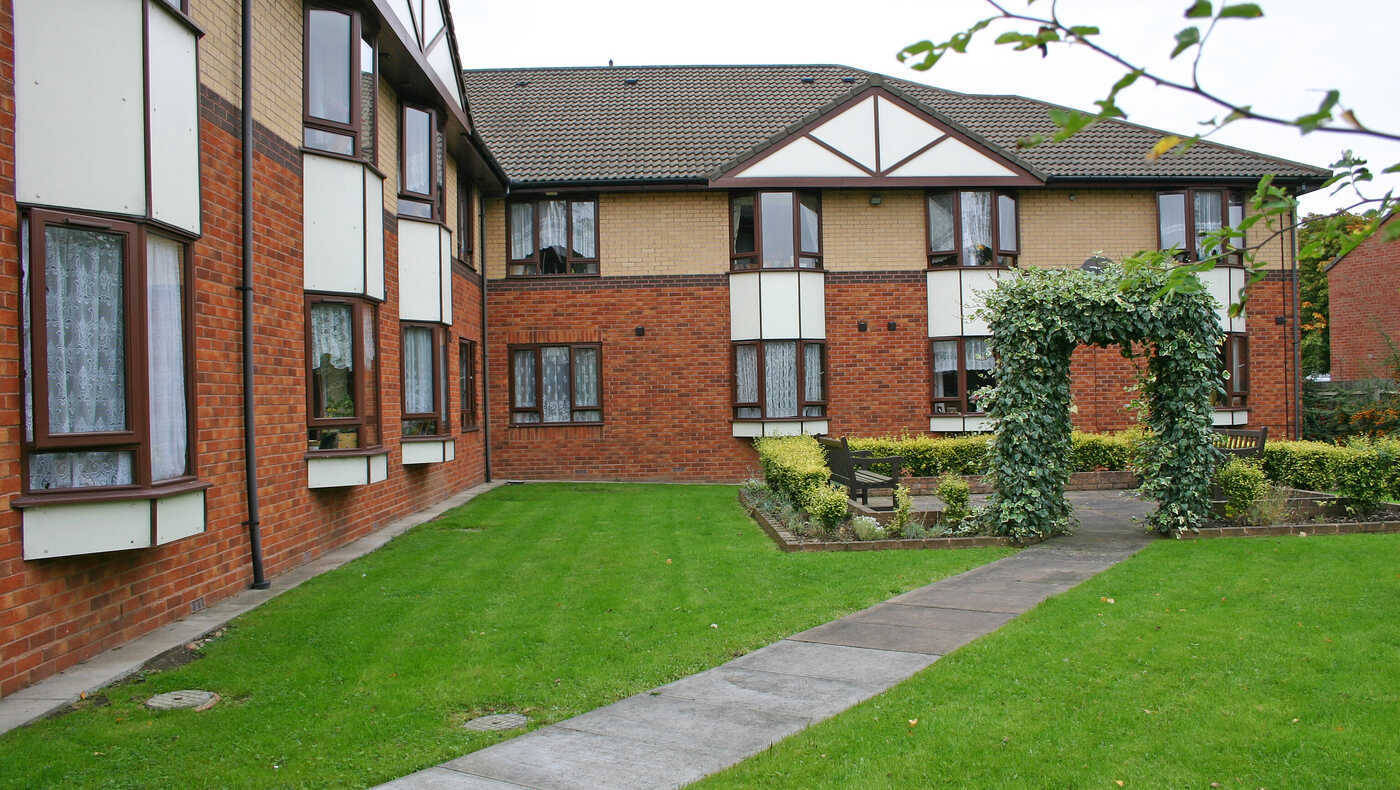 Well-maintained garden area with paths and shrubs