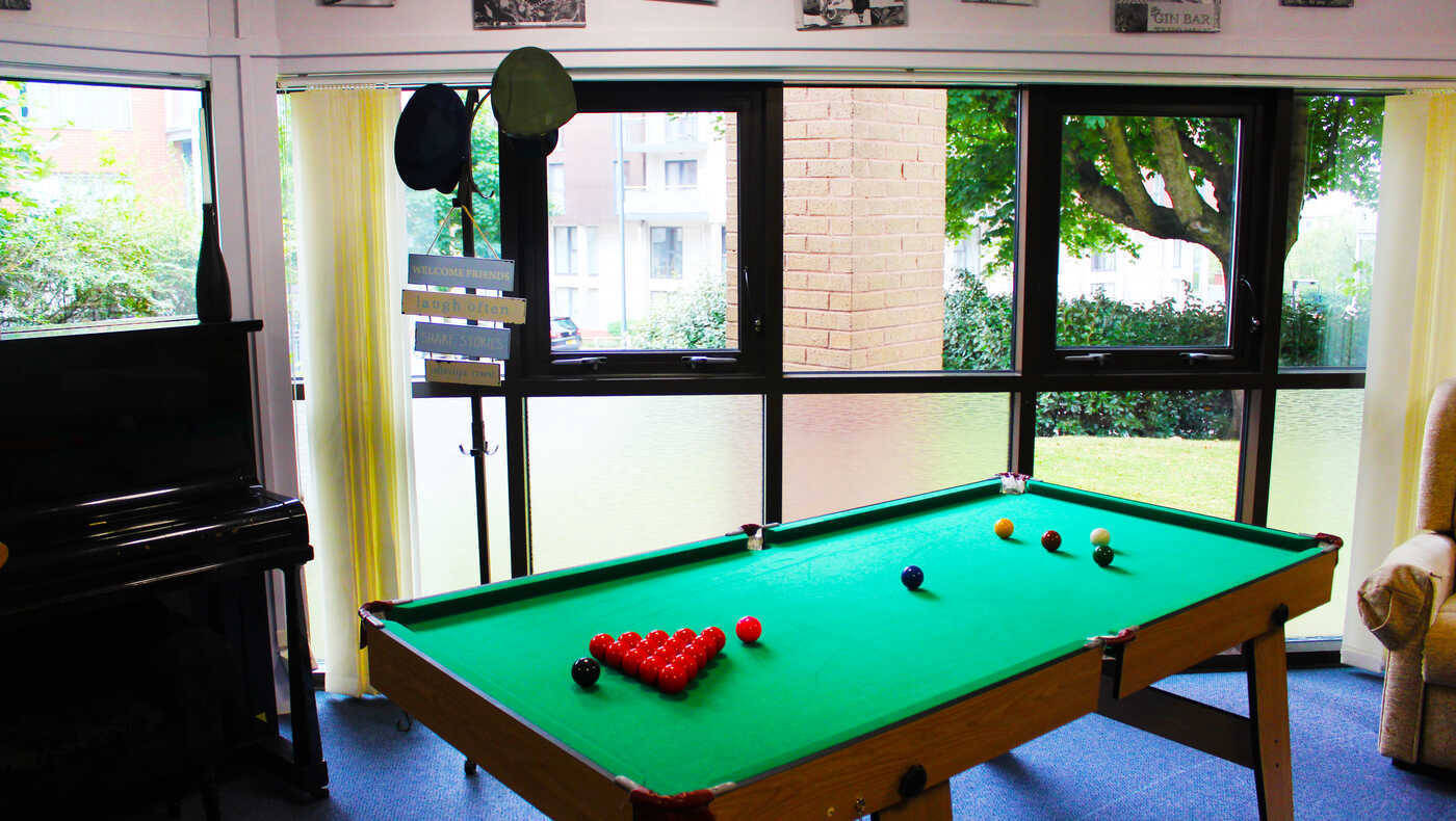 Interior of a common area with a pool table