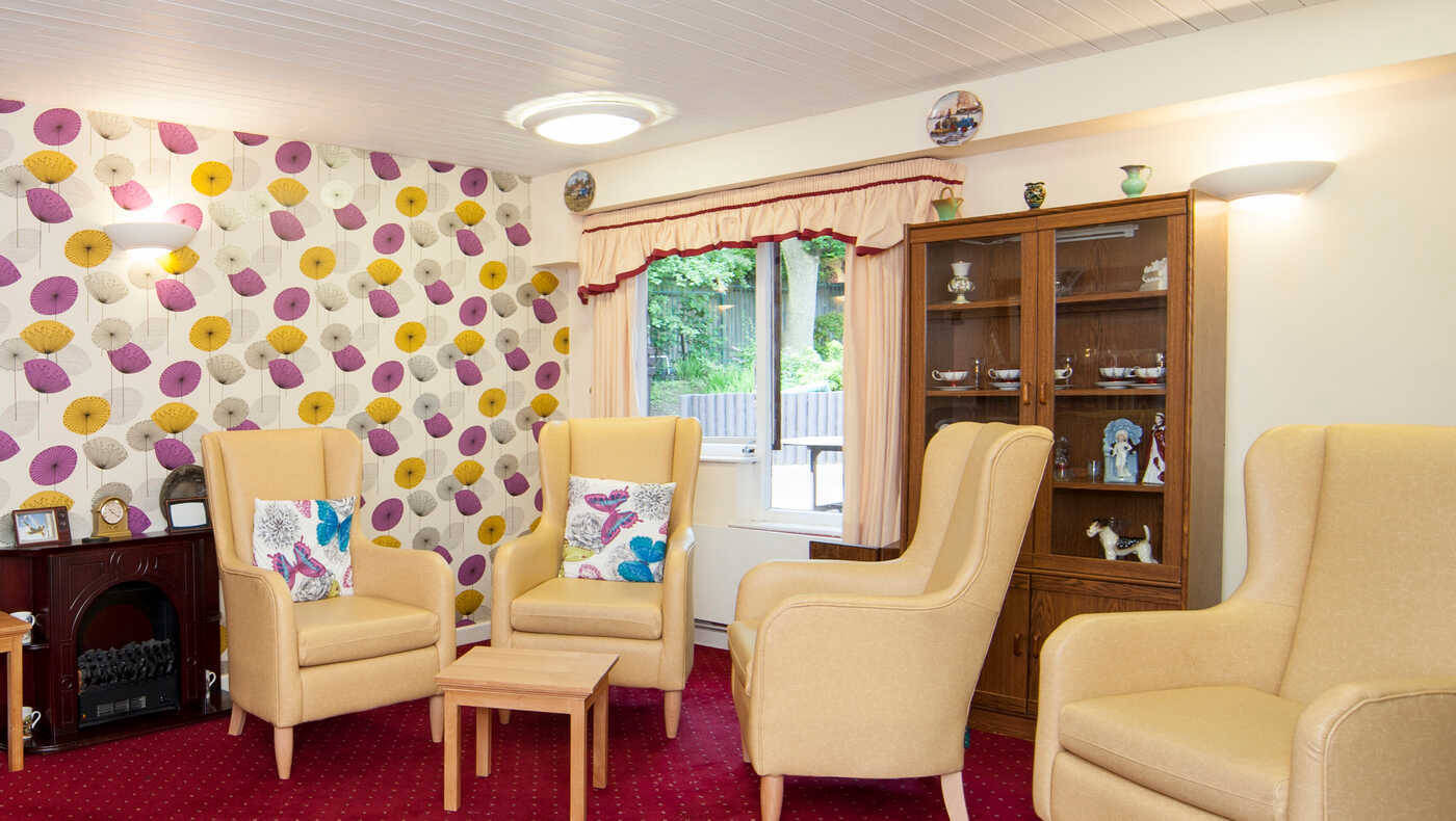 Cozy common area with seating and colorful wallpaper