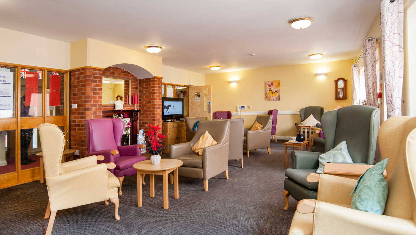 Common area with comfortable seating in a nursing home