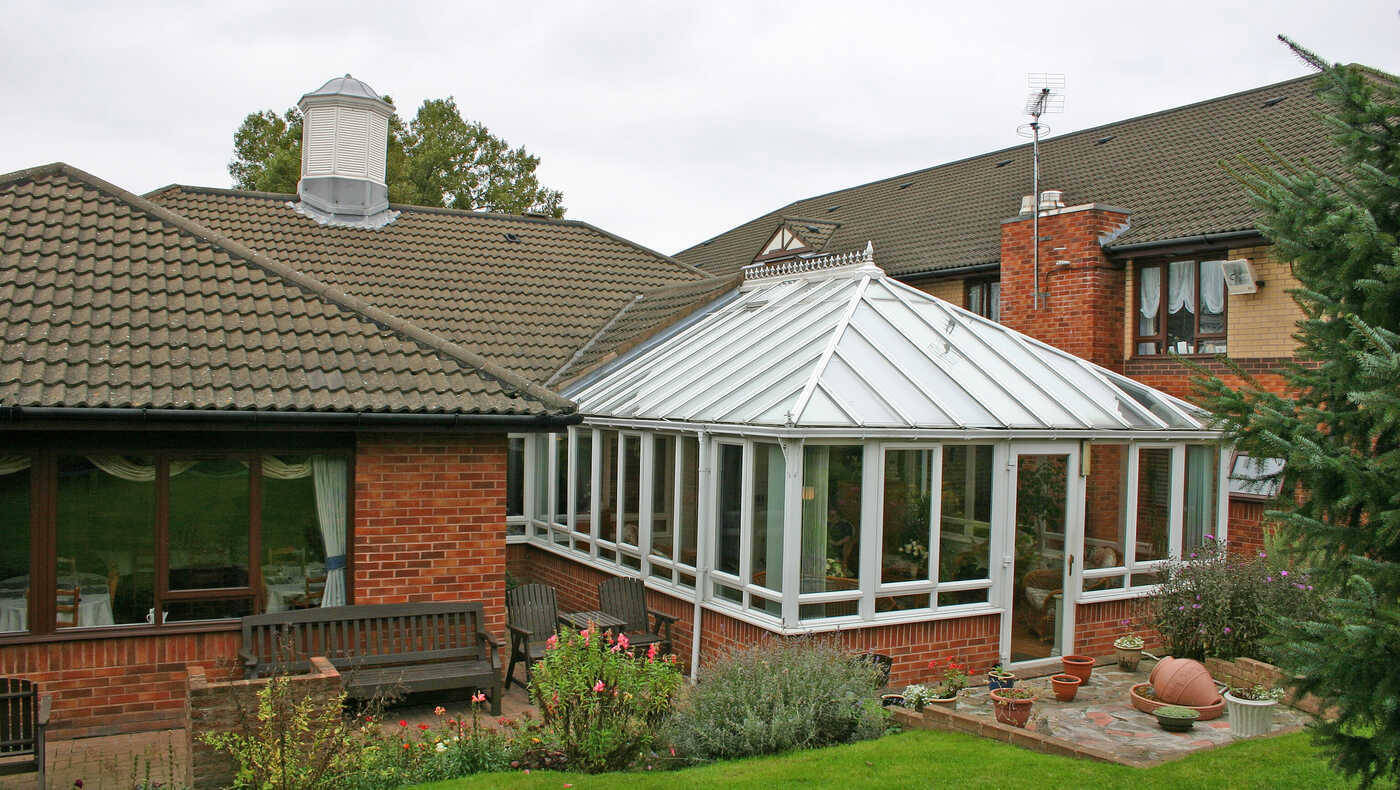 Conservatory area with seating and green space