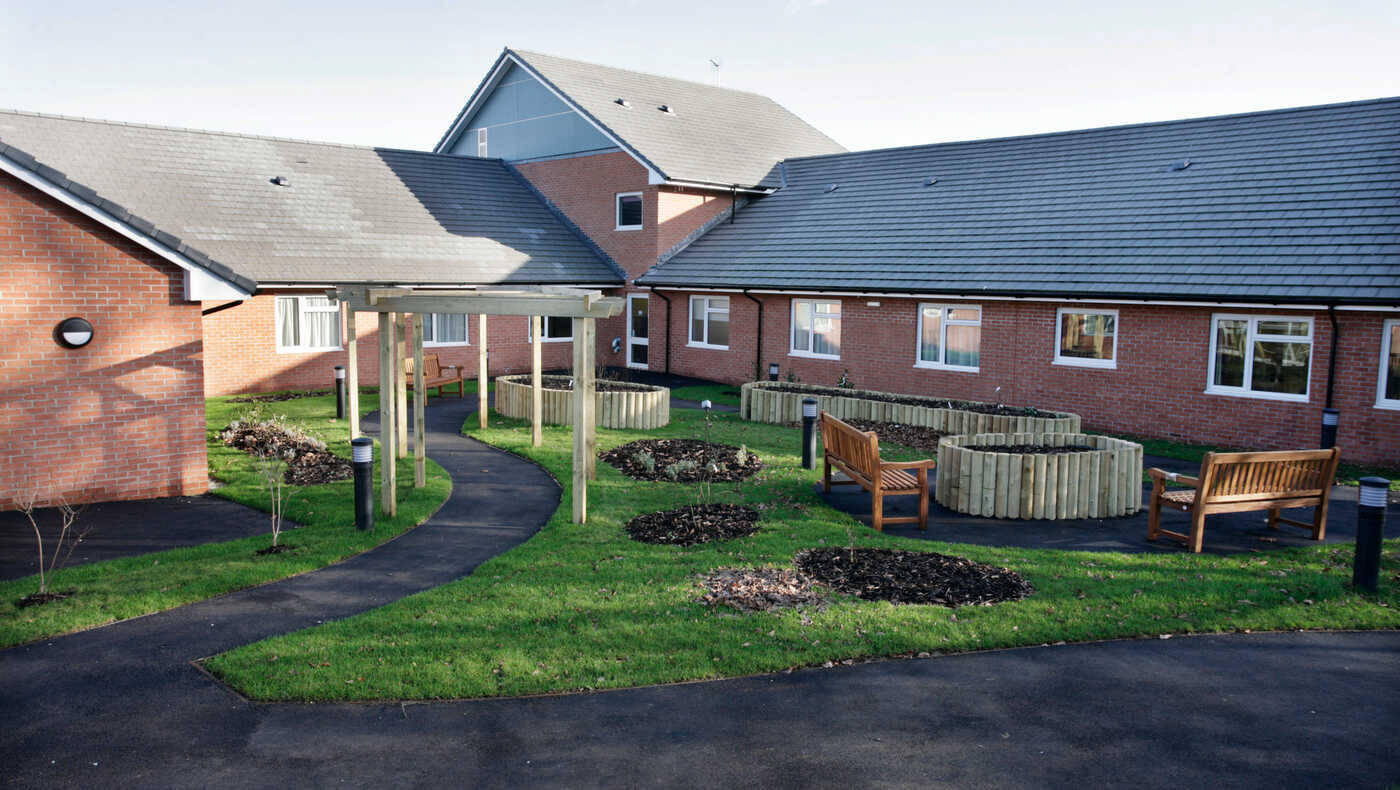 Outdoor garden area with benches and pathways