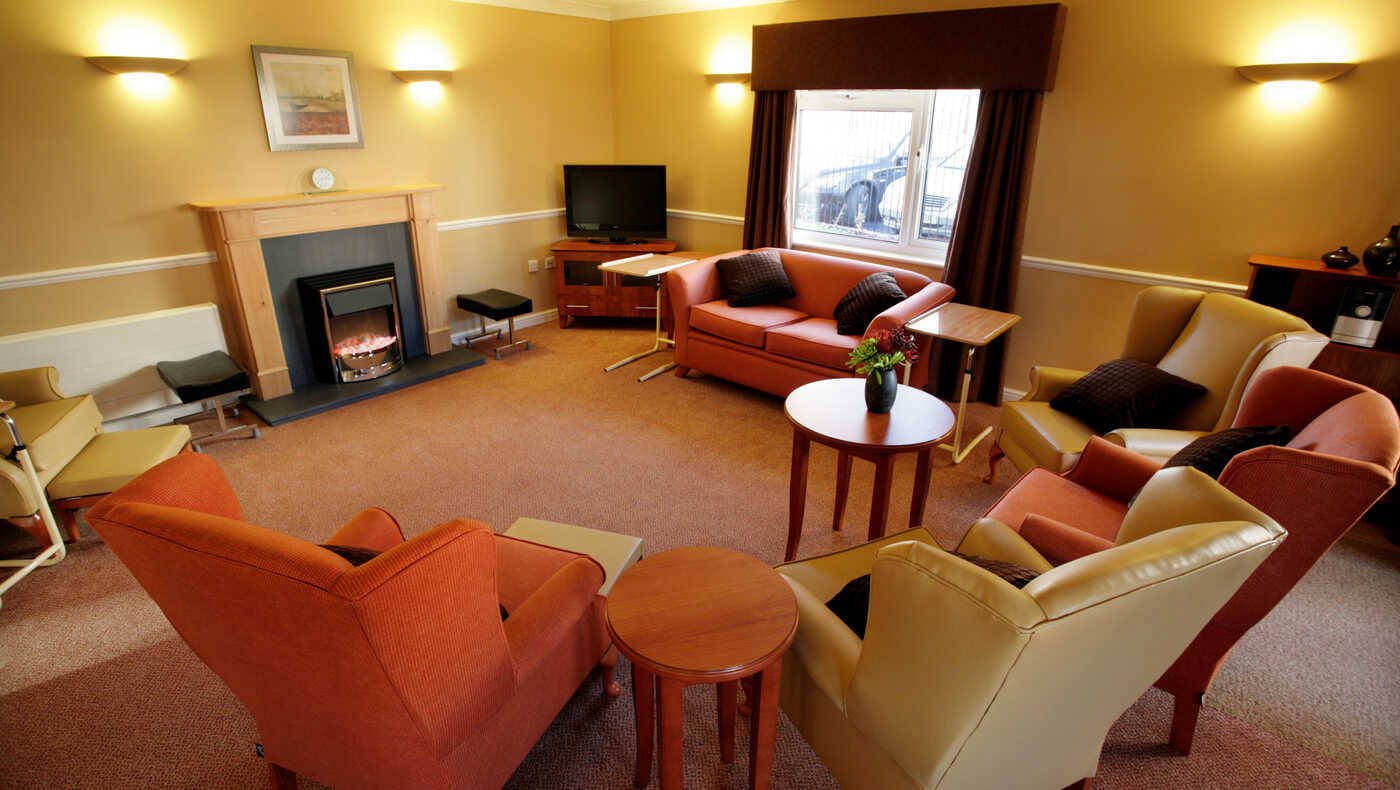Cozy common area with seating and a fireplace