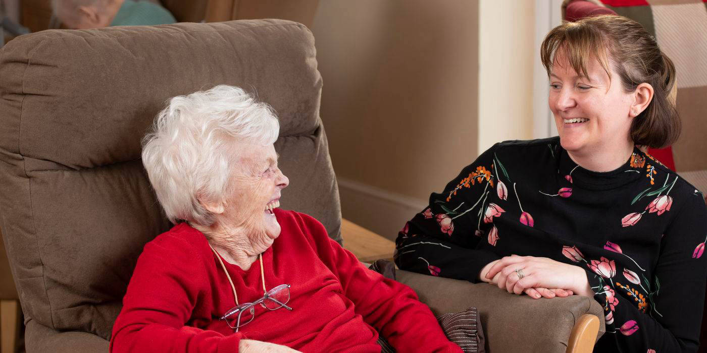 A resident and staff member enjoying a moment together