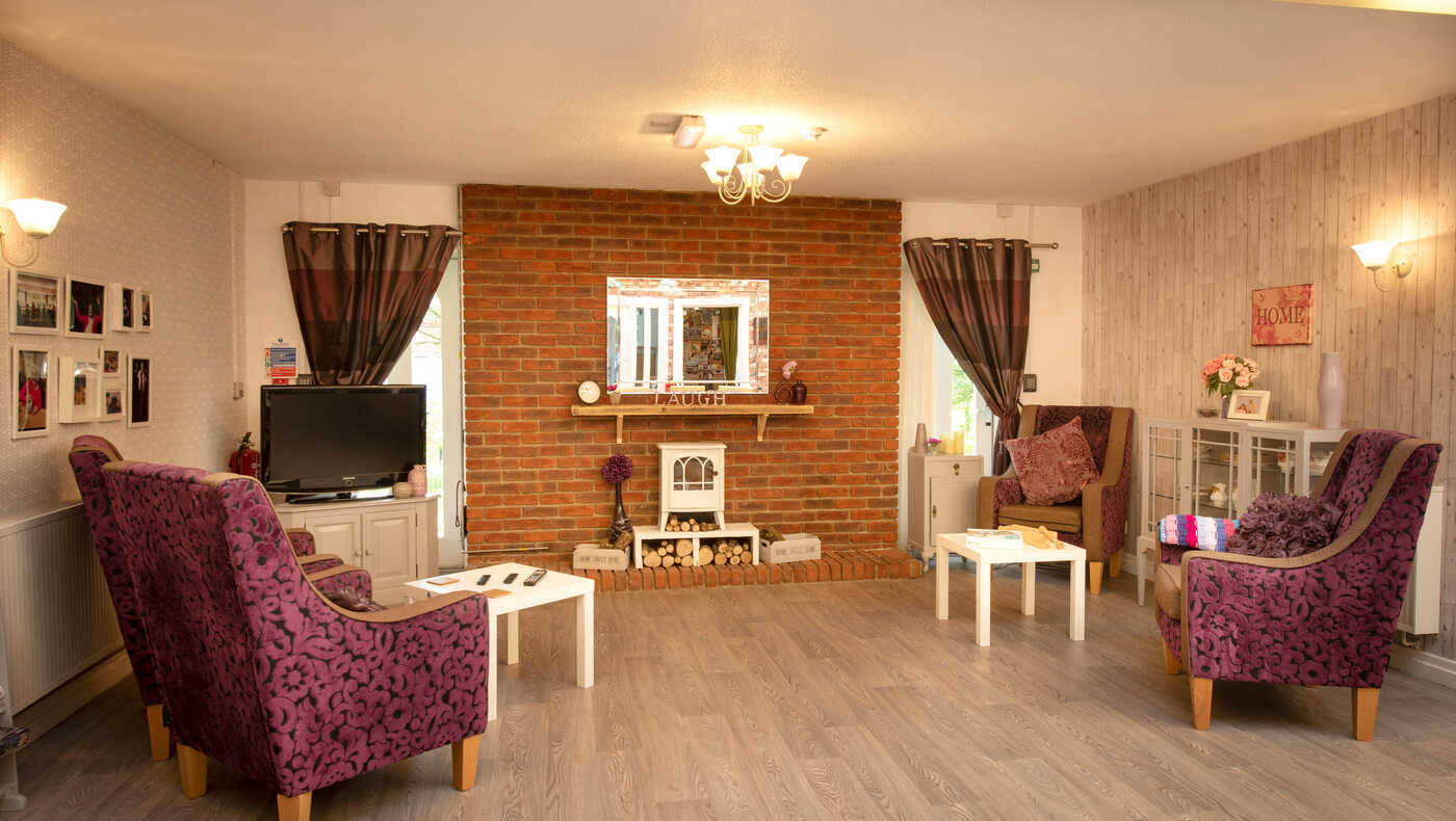 Cozy common area with comfortable seating and a fireplace
