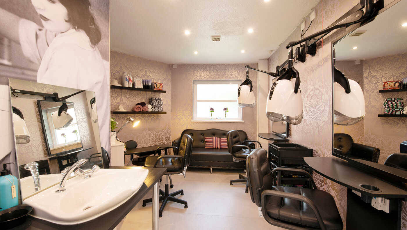Salon area with styling chairs and equipment