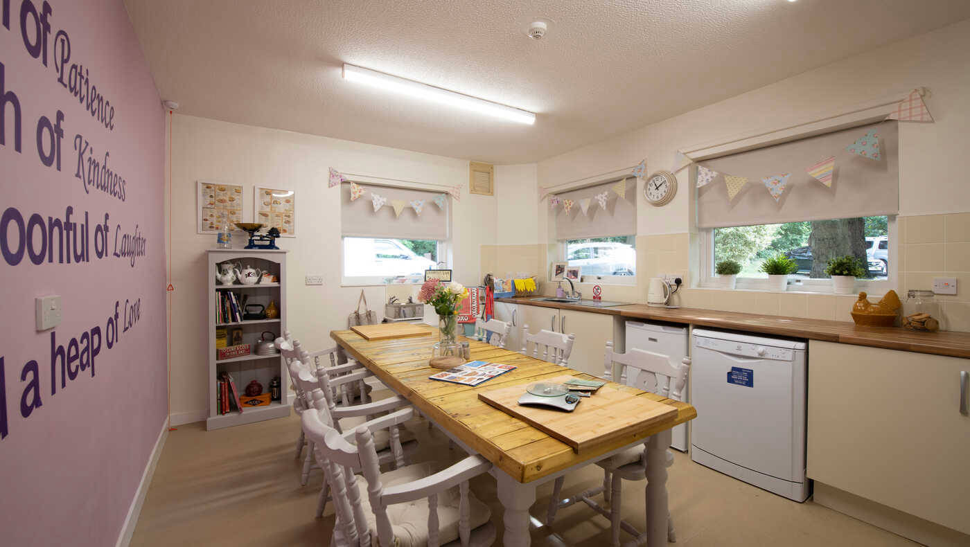 Interior view of a kitchen area with a large table