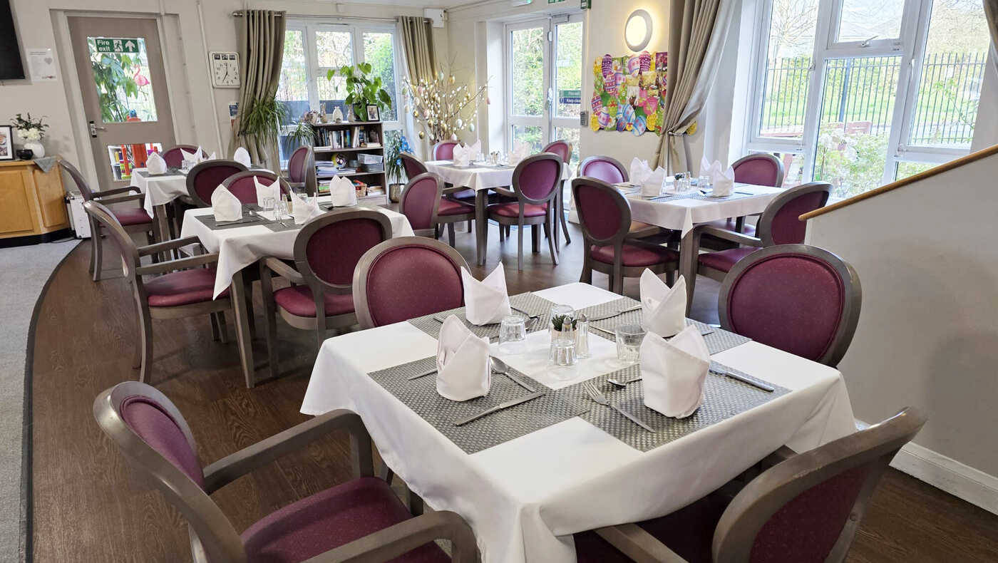 Dining room set for meal service with elegant decor