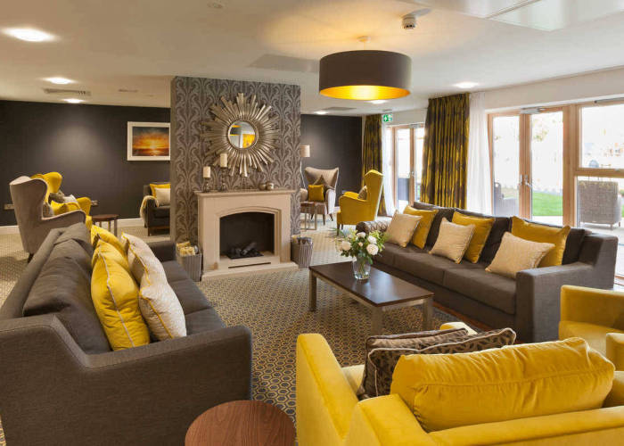 Bright and inviting common area with yellow accents