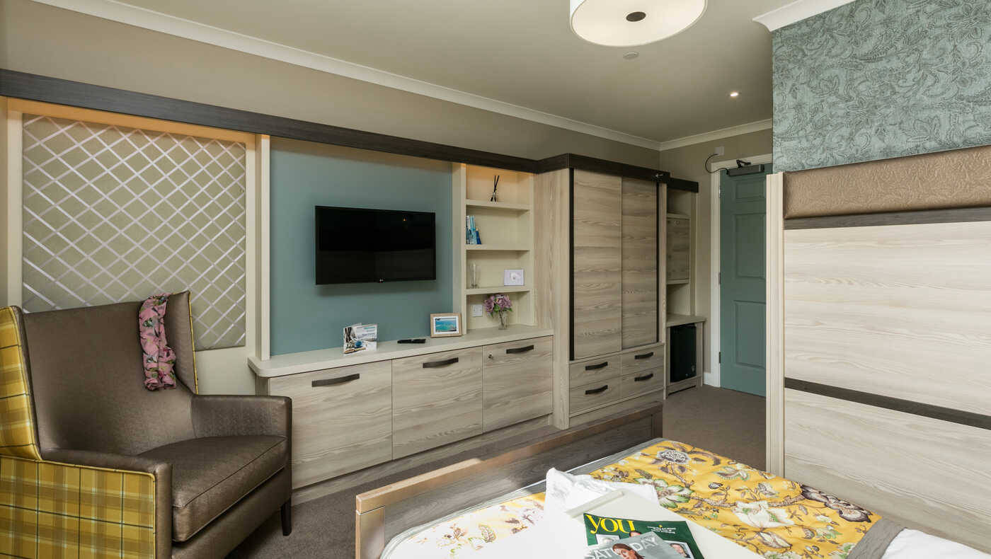 Interior view of a resident's room with furniture