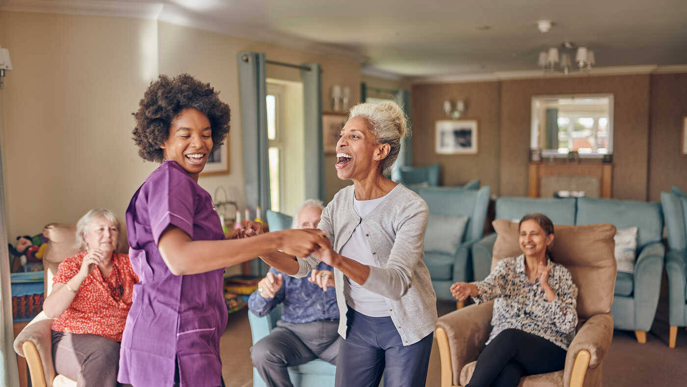 Residents and staff enjoying a fun activity together