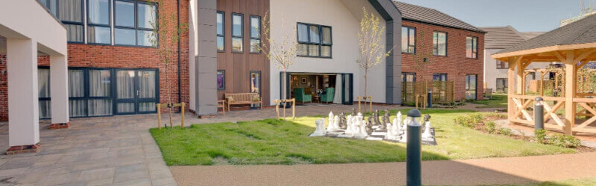 Exterior view of a nursing home with outdoor space
