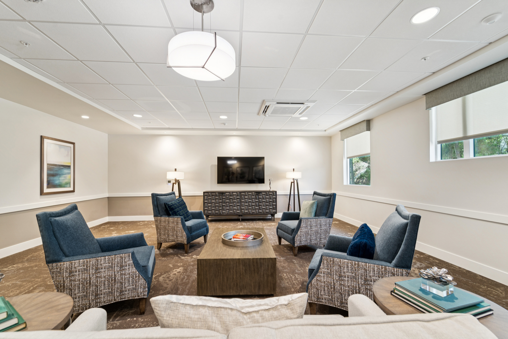 Bright common area with seating and television