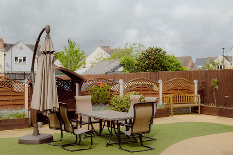 Outdoor seating area with tables and chairs