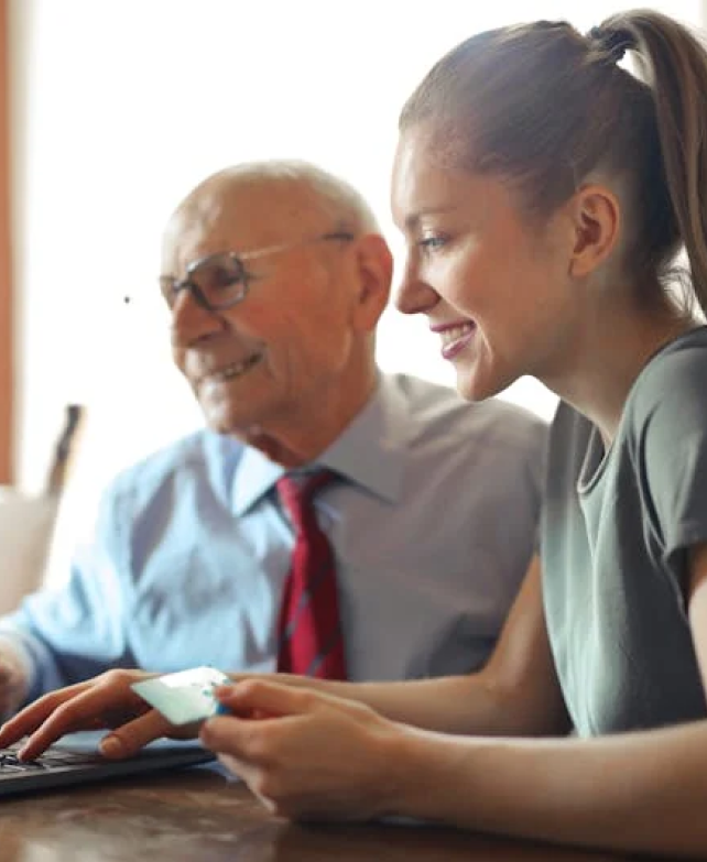 Older man and young woman engaging happily