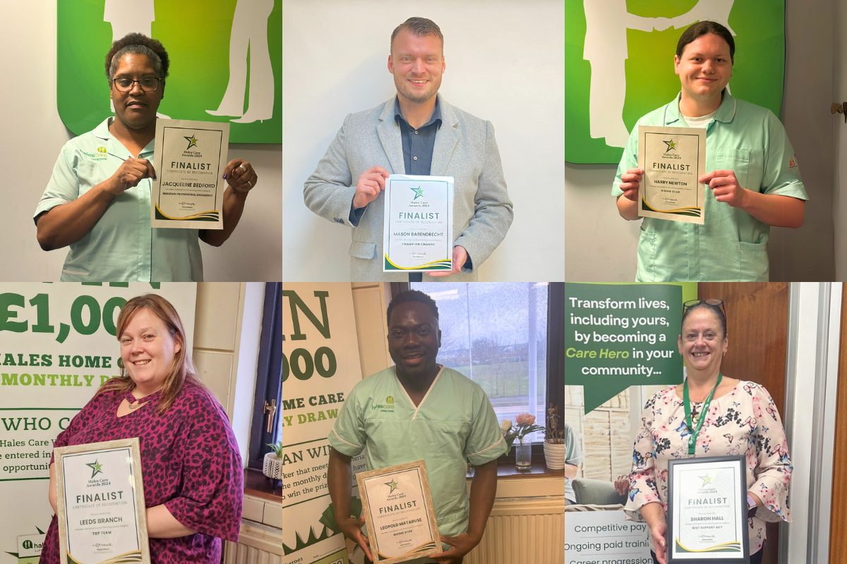 Staff members displaying awards and certificates