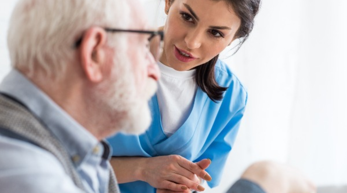 Nurse interacting with a senior resident