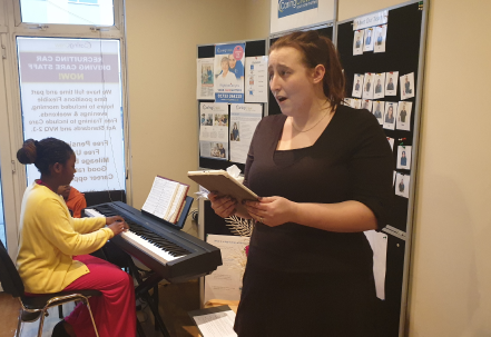 A staff member engaging with residents during an activity.