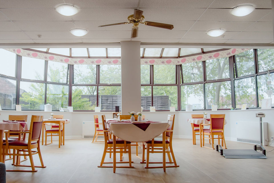 Dining area with tables and large windows