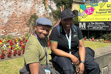 Two people enjoying a garden area at the facility.