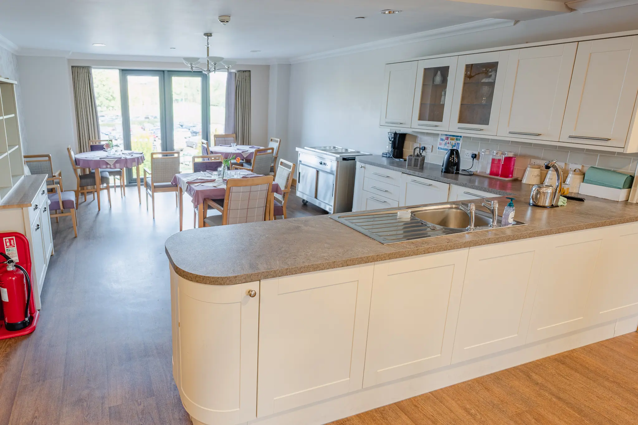 Bright communal kitchen and dining area.