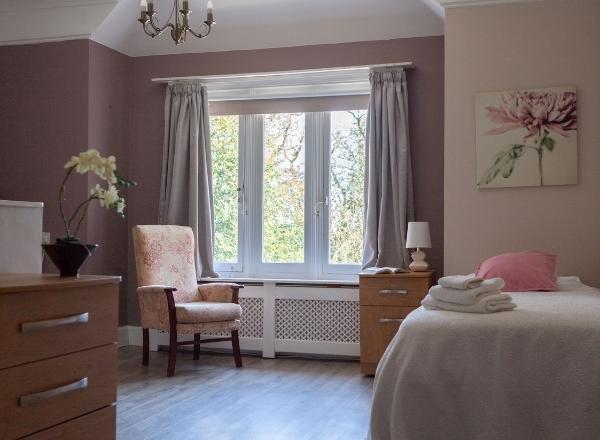 Cozy resident room with natural light and floral decor