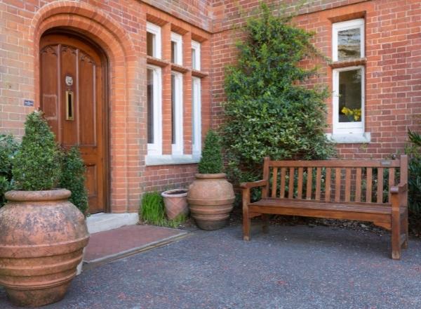 Outdoor seating area with a bench and planters