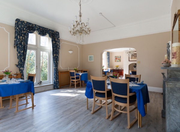 Dining room with tables set for meals