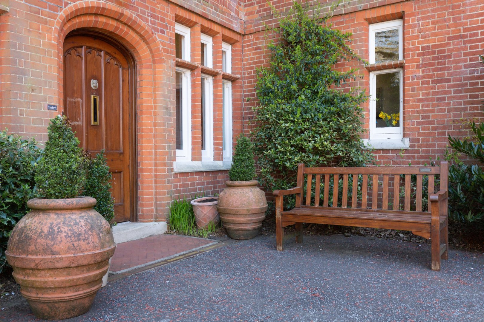 Outdoor seating area with a brick facade