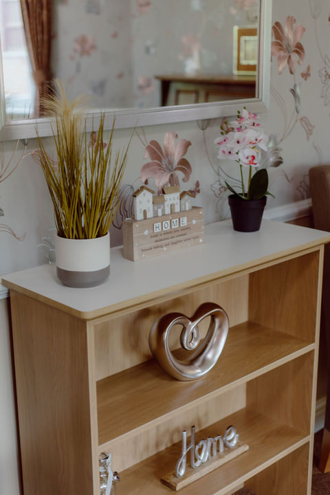 Cozy interior decor with plants and a heart-shaped sculpture