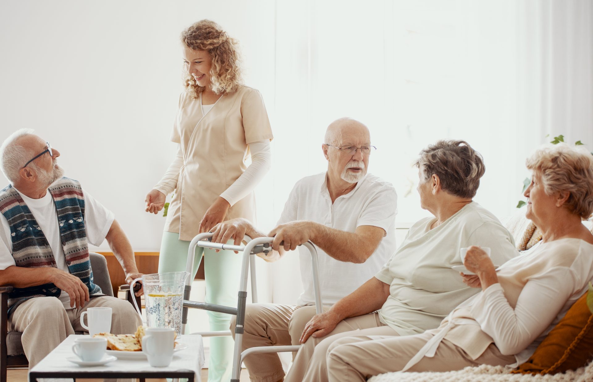 Residents engaged in conversation with staff.