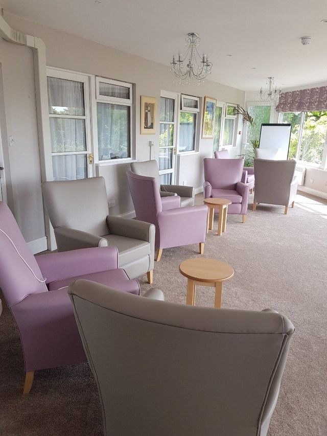 Common area with chairs and soft lighting.