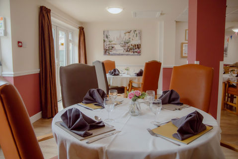 Dining area set up with decorated table.