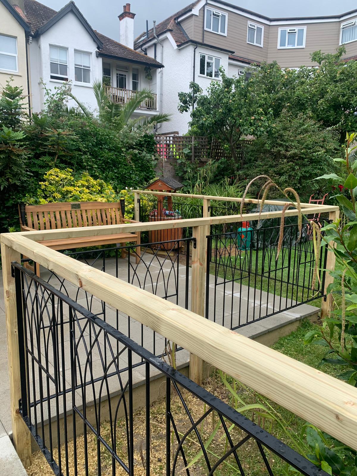 Outdoor garden area with seating and greenery.