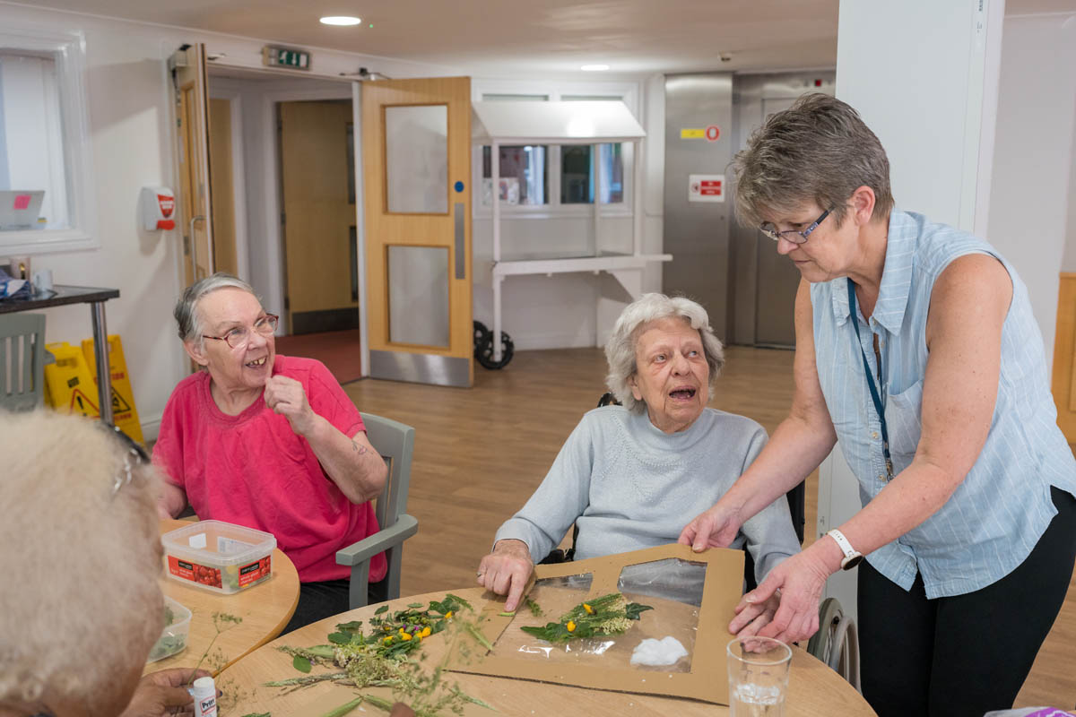Residents engaged in an arts and crafts activity