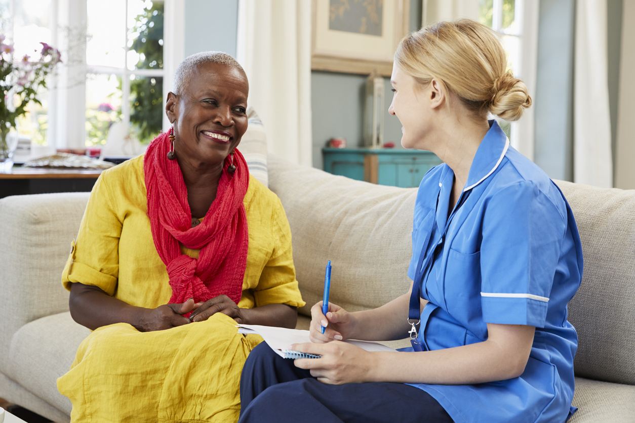 Patient and caregiver engaged in conversation.