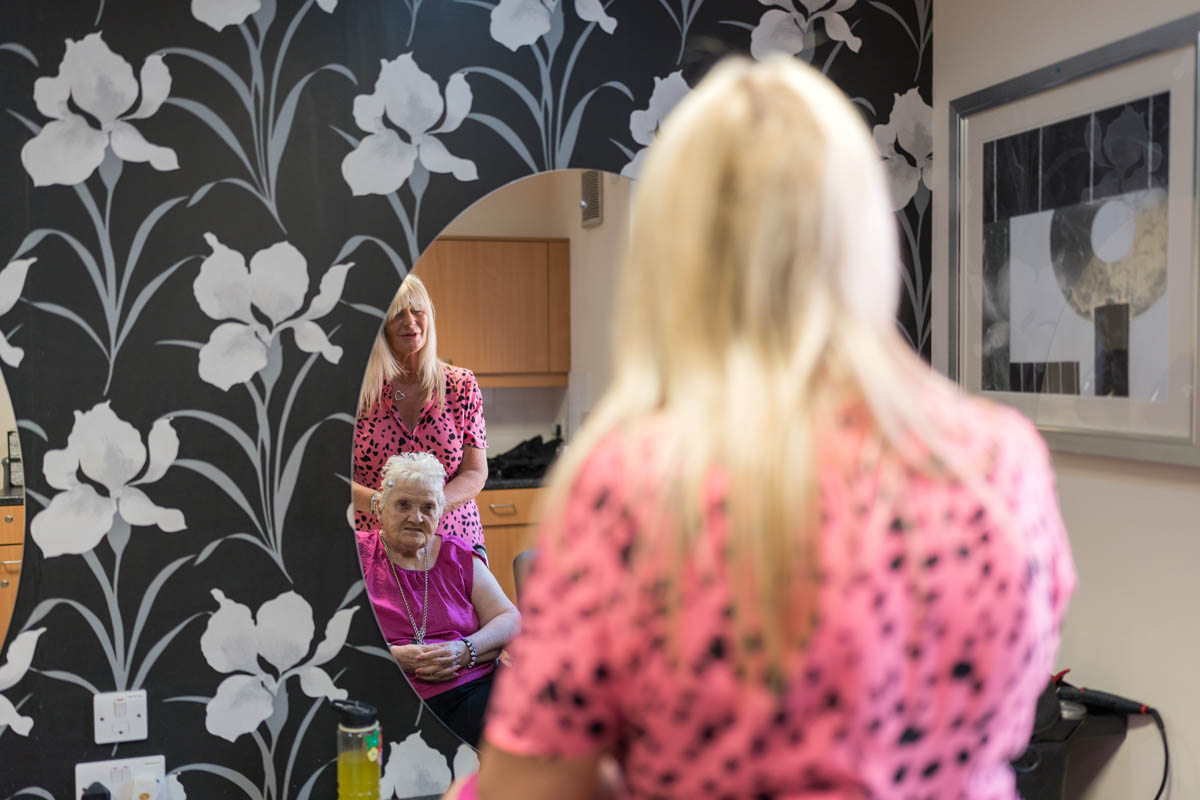 Resident getting a haircut in a salon