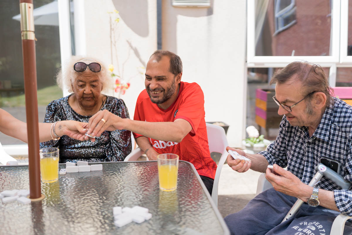 Residents enjoying a game outside.
