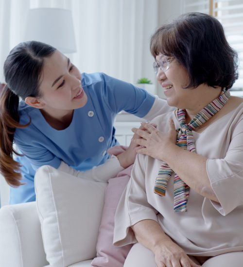 Caregiver interacting warmly with a resident