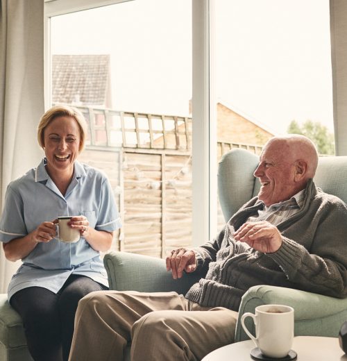 Caregiver and resident enjoying time together.