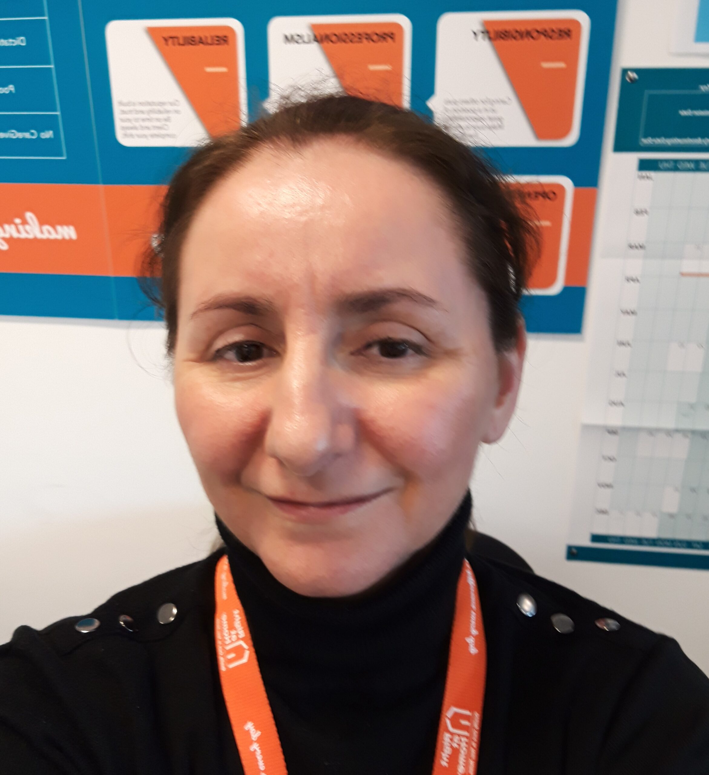 Staff member smiling in the facility.