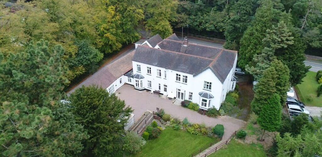 Aerial view of Grove House exterior and gardens