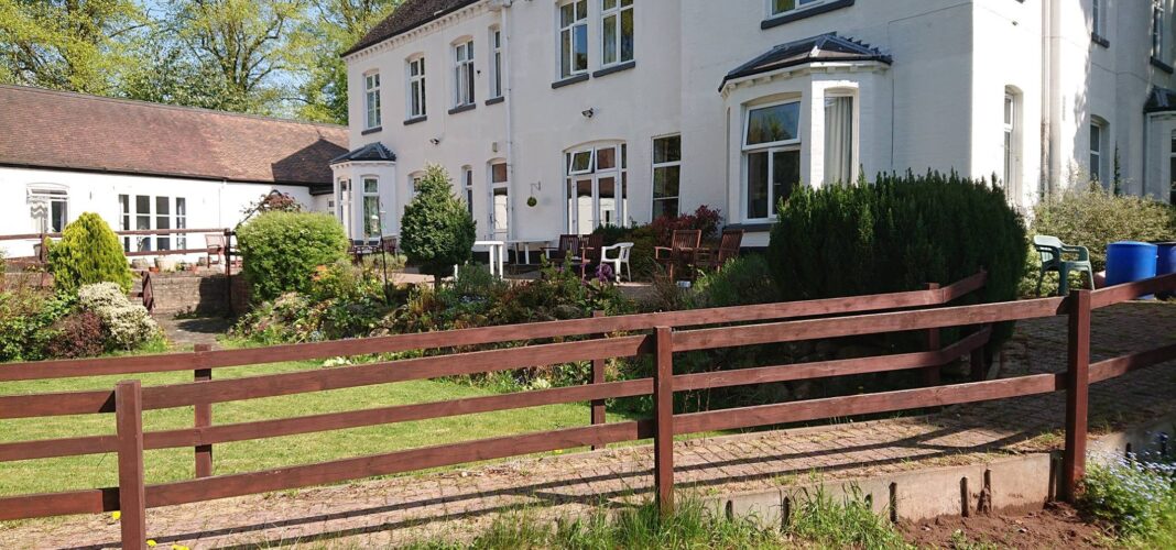 Exterior view of Grove House and garden area.